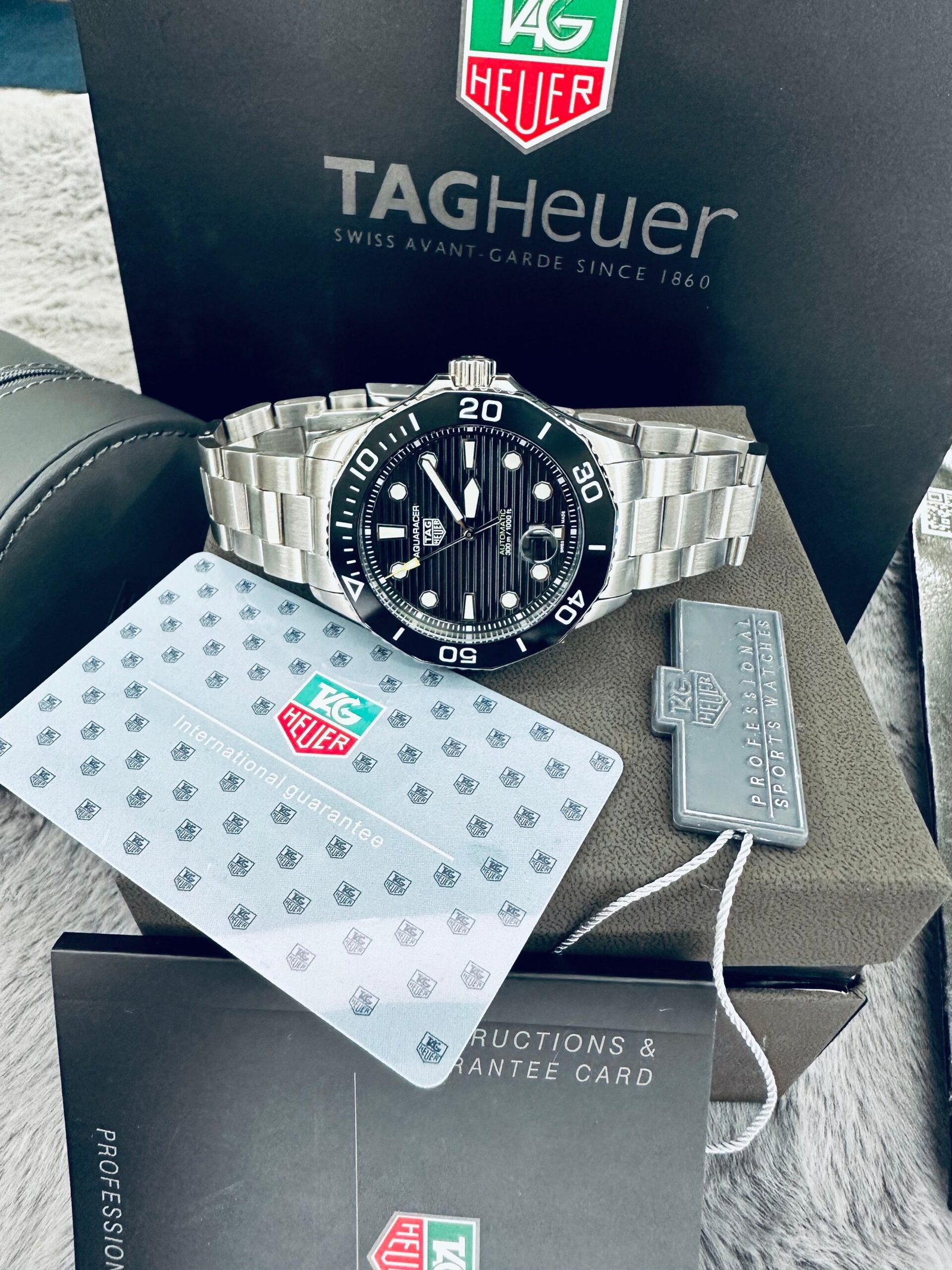 WW2330.jpg Tag Heuer Aquaracer 300M Automatic Ceramic Bezel Men’s Stainless Steel Chain Watch
