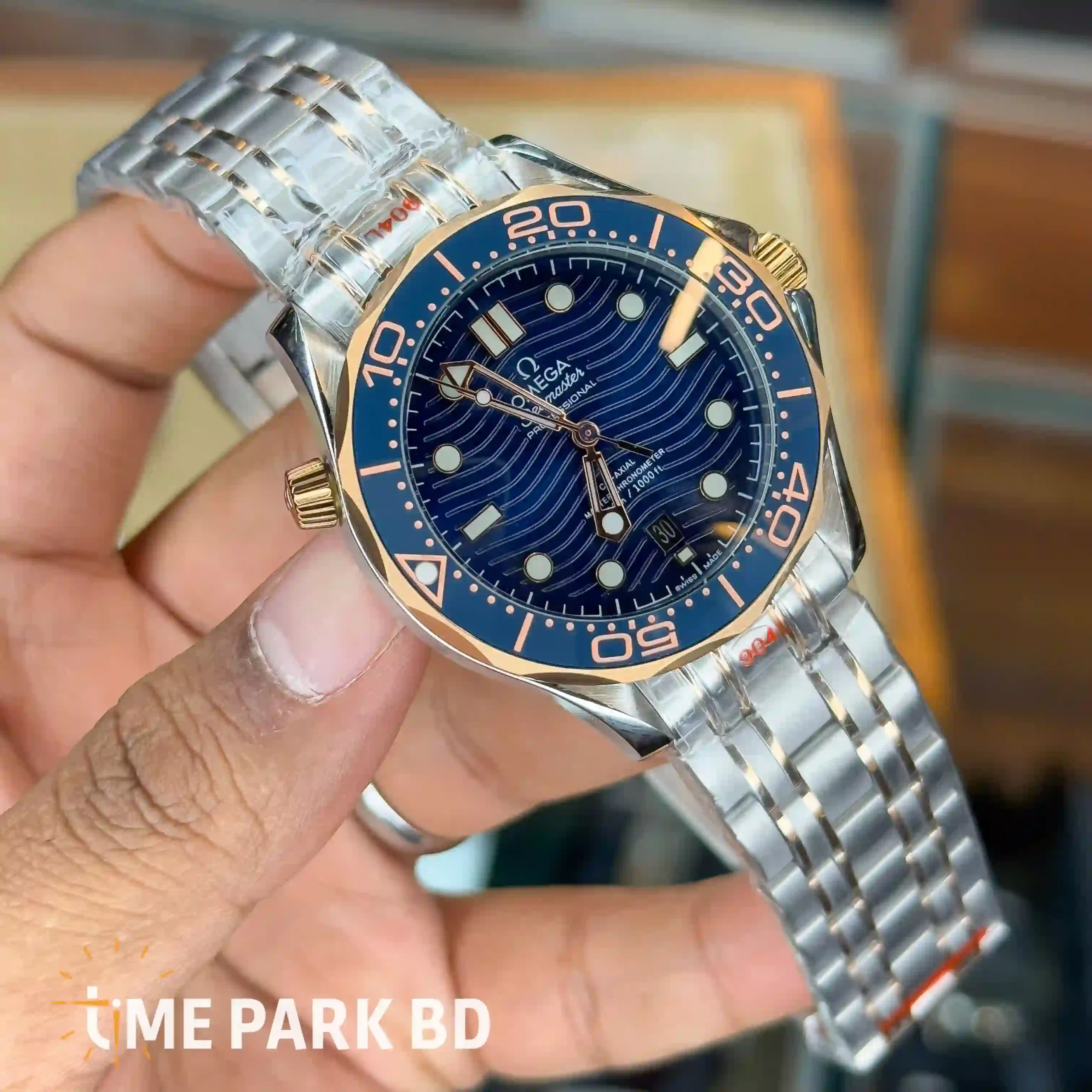 IMG_0728_result Omega — Blue Wave Dial, Gold-Accented Blue Bezel & Silver-Tone Bracelet - Image 2